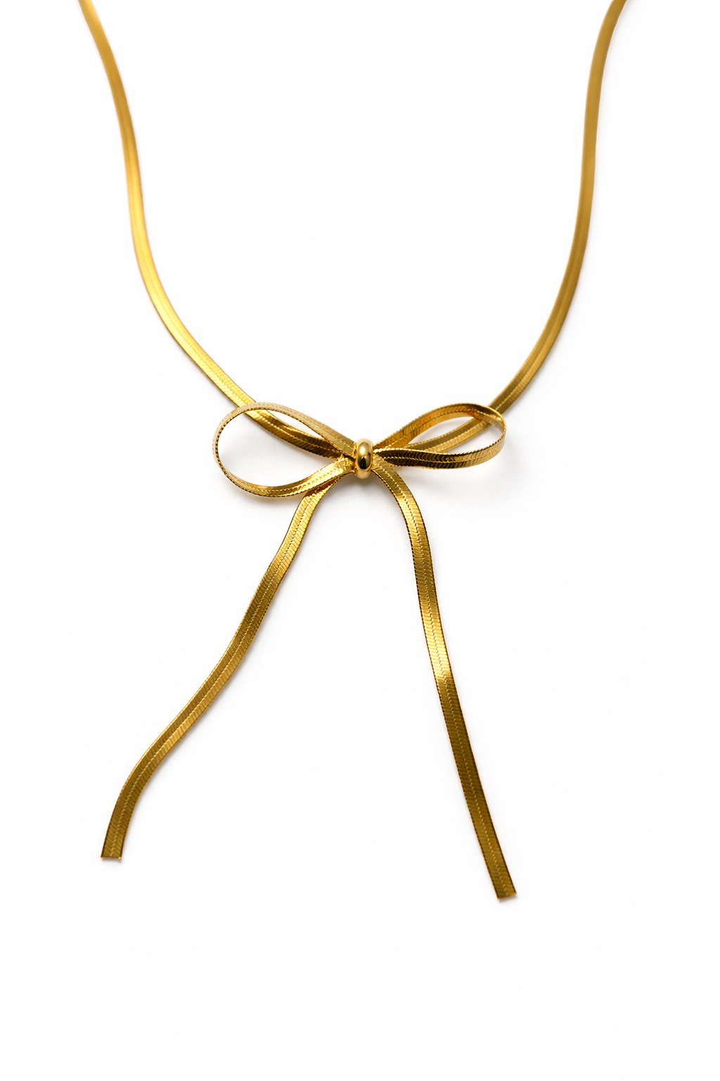 Gold necklace with a bow on a white background by Zenva