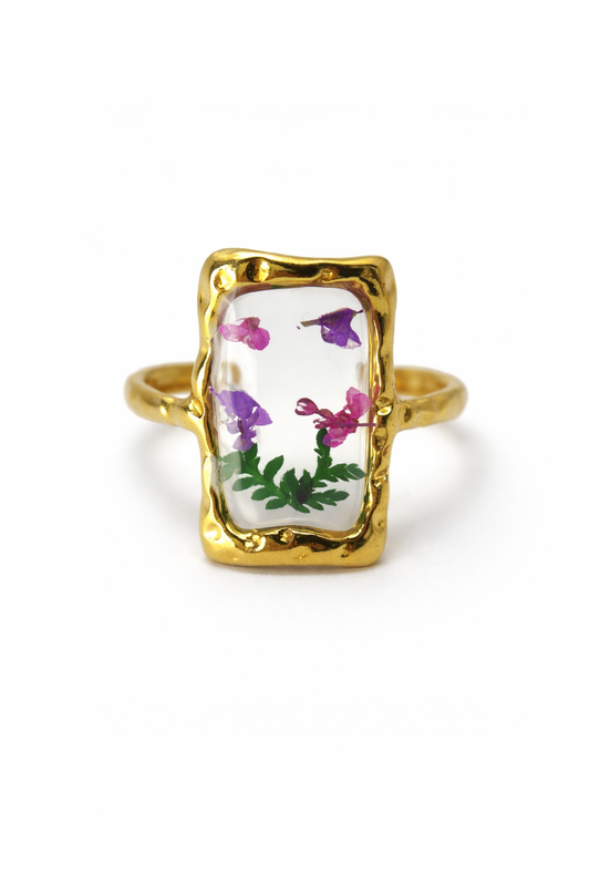 Gold ring with floral design on a transparent background by Zenva