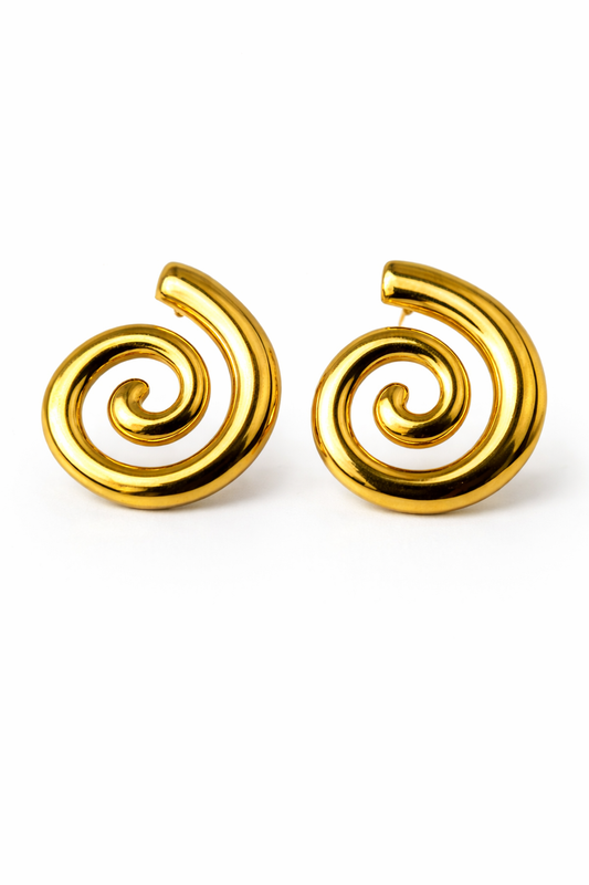 Pair of gold spiral earrings on a white background by Zenva