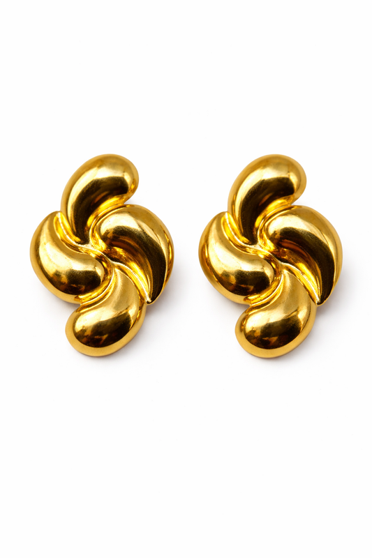 Pair of gold knot earrings on a white background by Zenva
