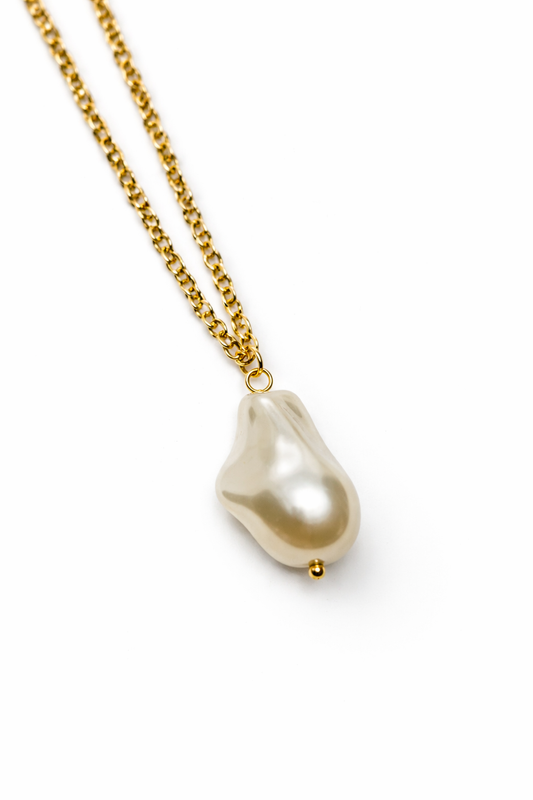 Pearl necklace with gold chain on a white background by Zenva