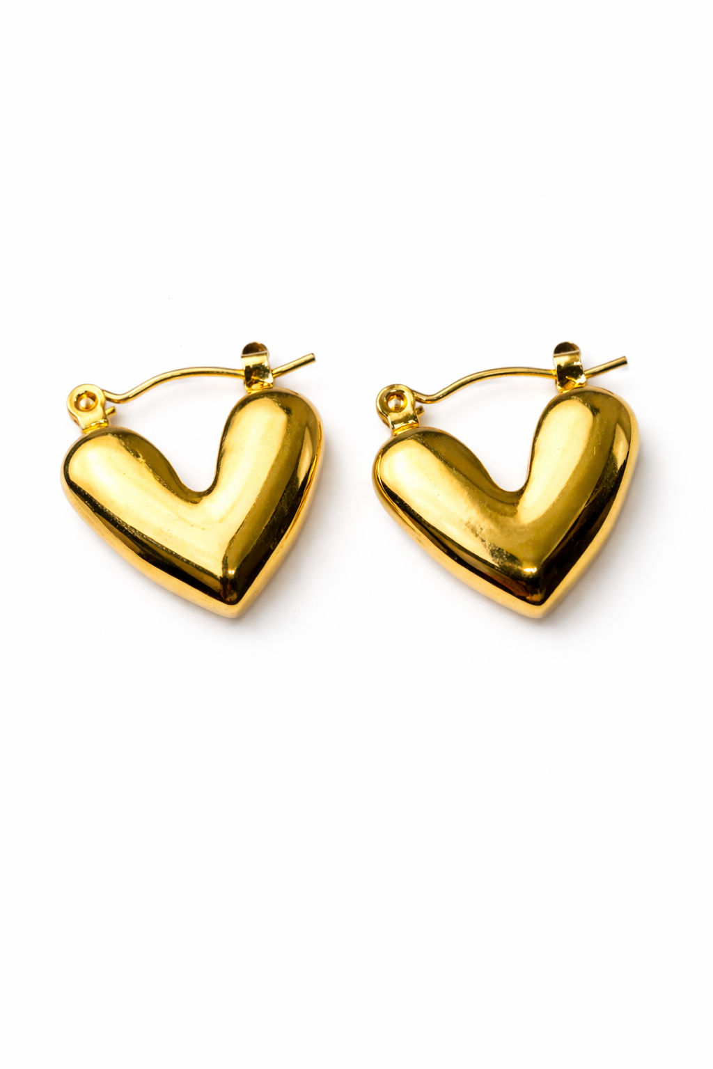 Gold heart-shaped hoop earrings on a white background by Zenva