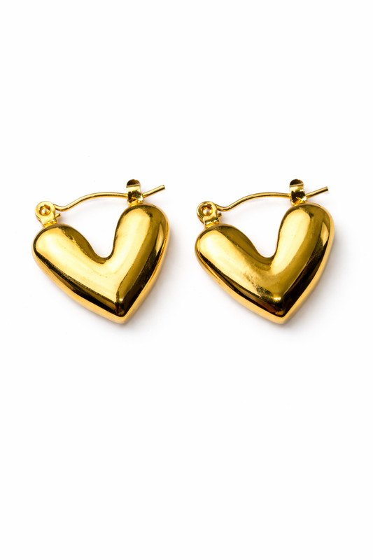 Gold heart-shaped hoop earrings on a white background by Zenva