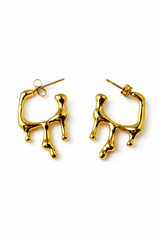 Gold hoop earrings on a white background by Zenva